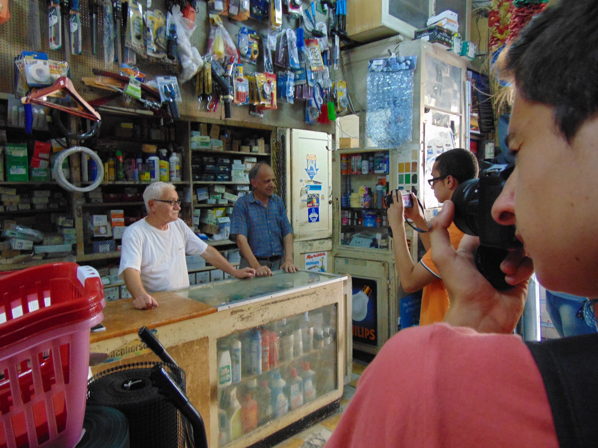 Youths taking pictures of Zabbar ironmongers. 